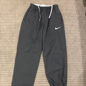 Black Nike track pants.